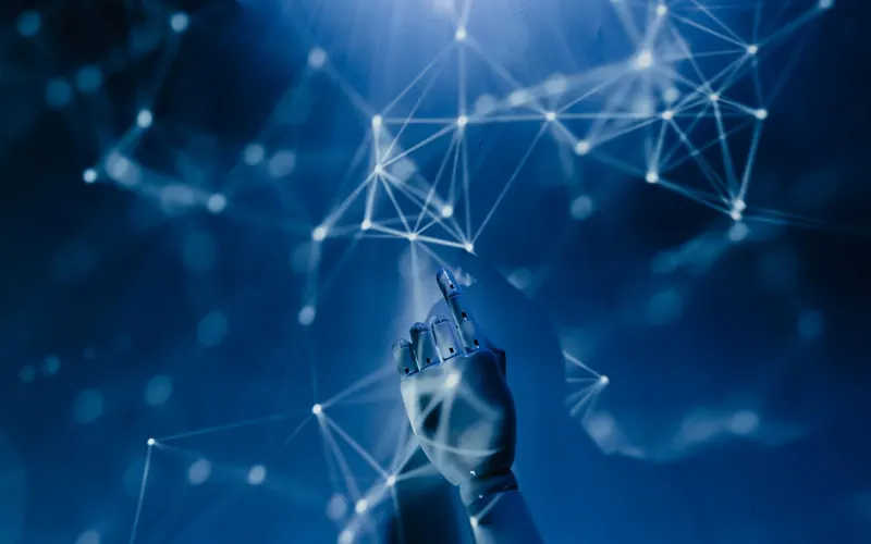Mano frente a una red de puntos conectados que representa la inteligencia artificial